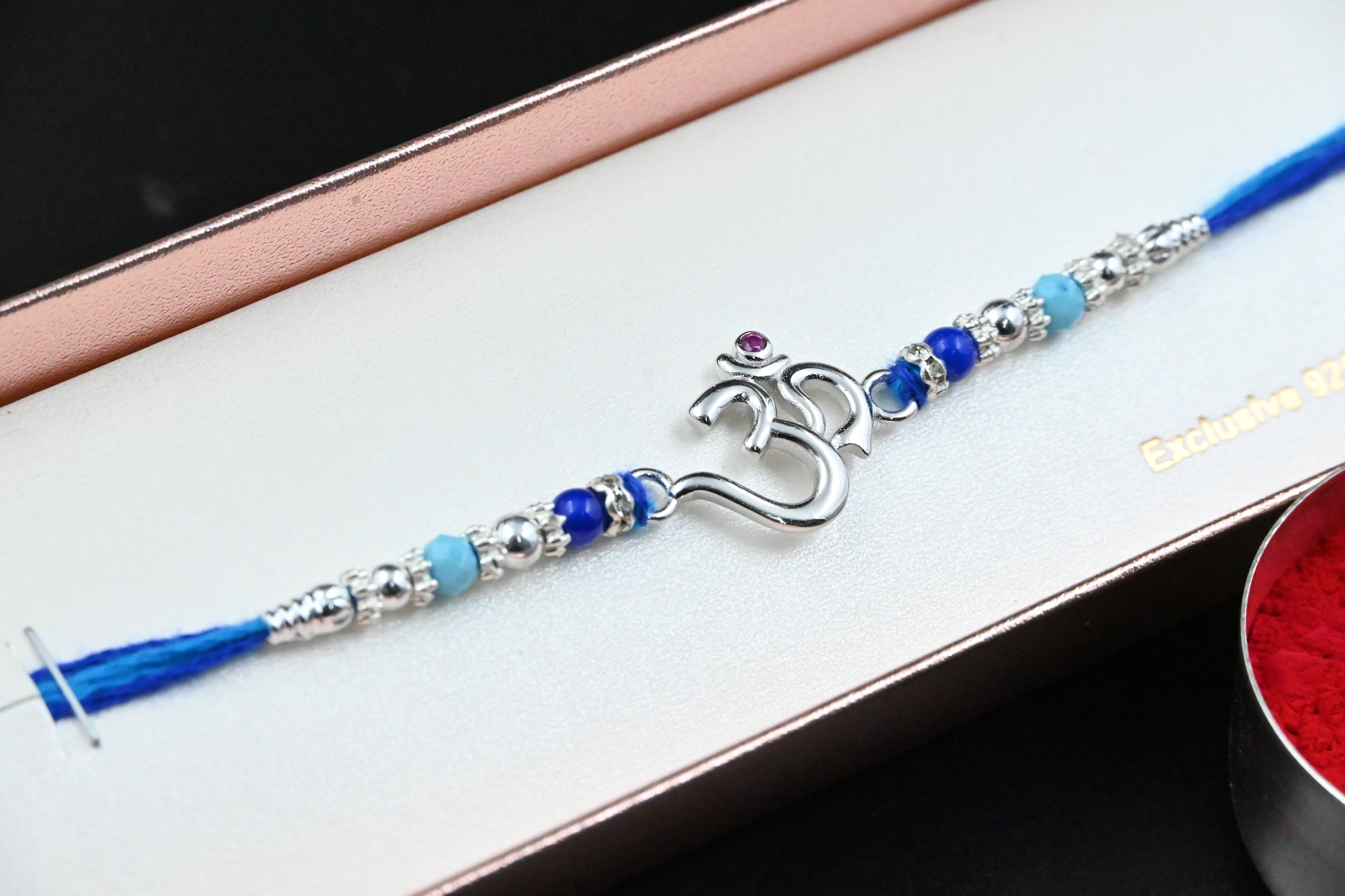 Om Silver Rakhi